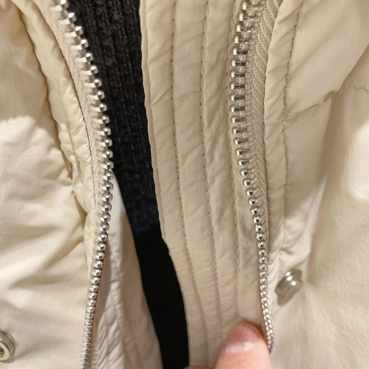 Close-up of Marisabel puffer jacket hood and collar detail