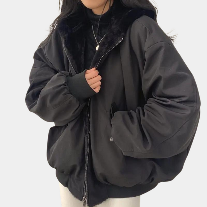 Noelani hooded oversized winter jacket in black, front view with plush hood lining