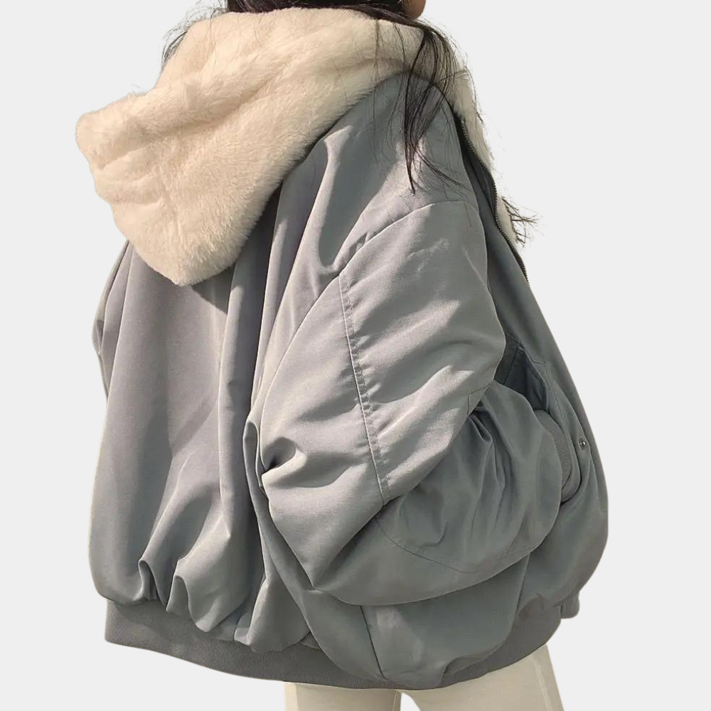 Noelani hooded oversized winter jacket in blue-gray, back view showing hood and silhouette