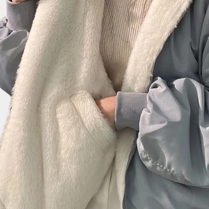 Noelani hooded oversized winter jacket in blue-gray, back view showing hood and silhouette