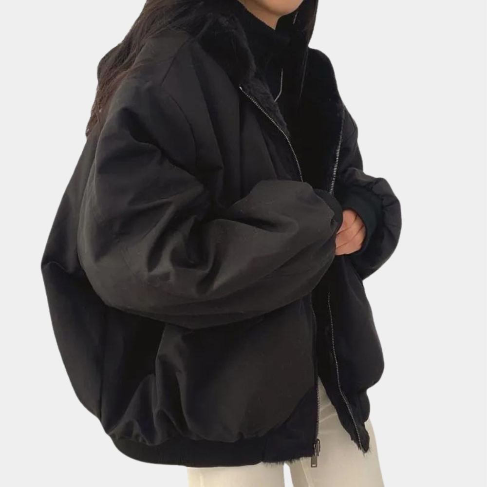 Noelani hooded oversized winter jacket in blue-gray, back view showing hood and silhouette