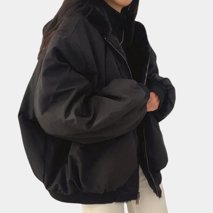 Noelani hooded oversized winter jacket in blue-gray, back view showing hood and silhouette
