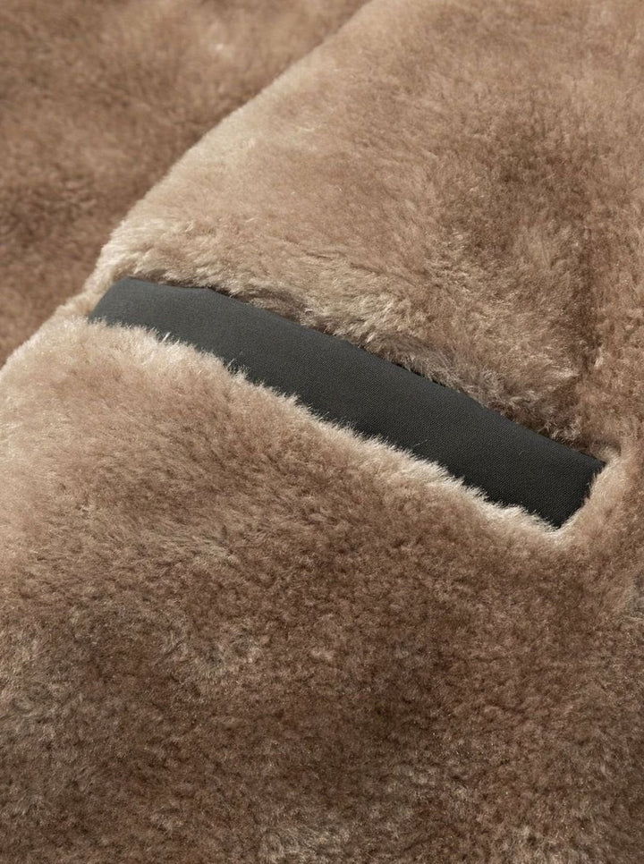 Close-up of Perpetua jacket hood, snap closures and fleece lining