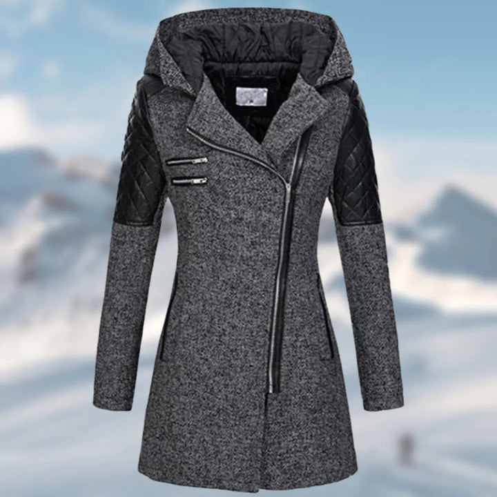 Imelda winter coat close-up of quilted sleeve panel and zipper pockets