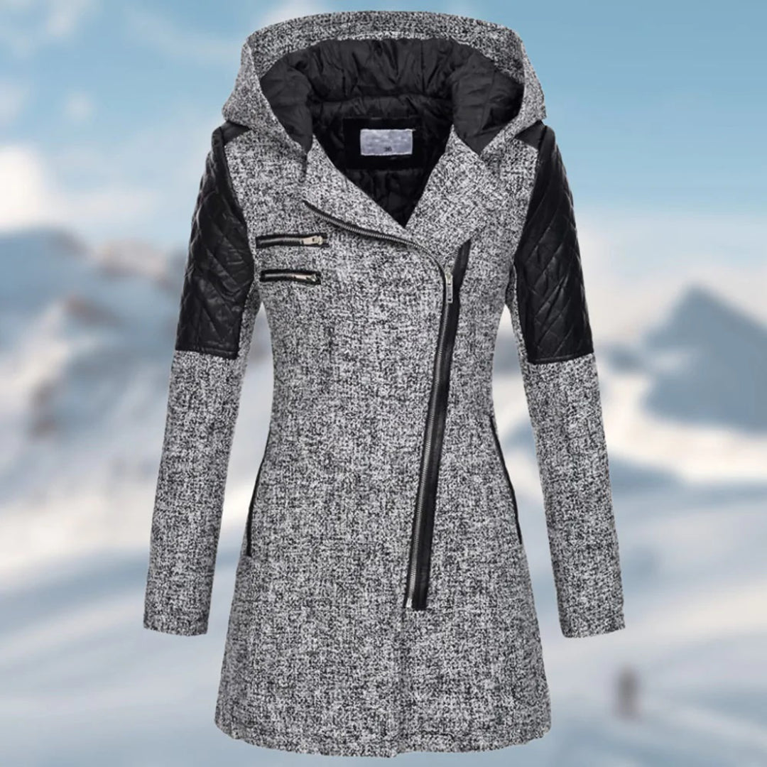 Imelda winter coat close-up of quilted sleeve panel and zipper pockets
