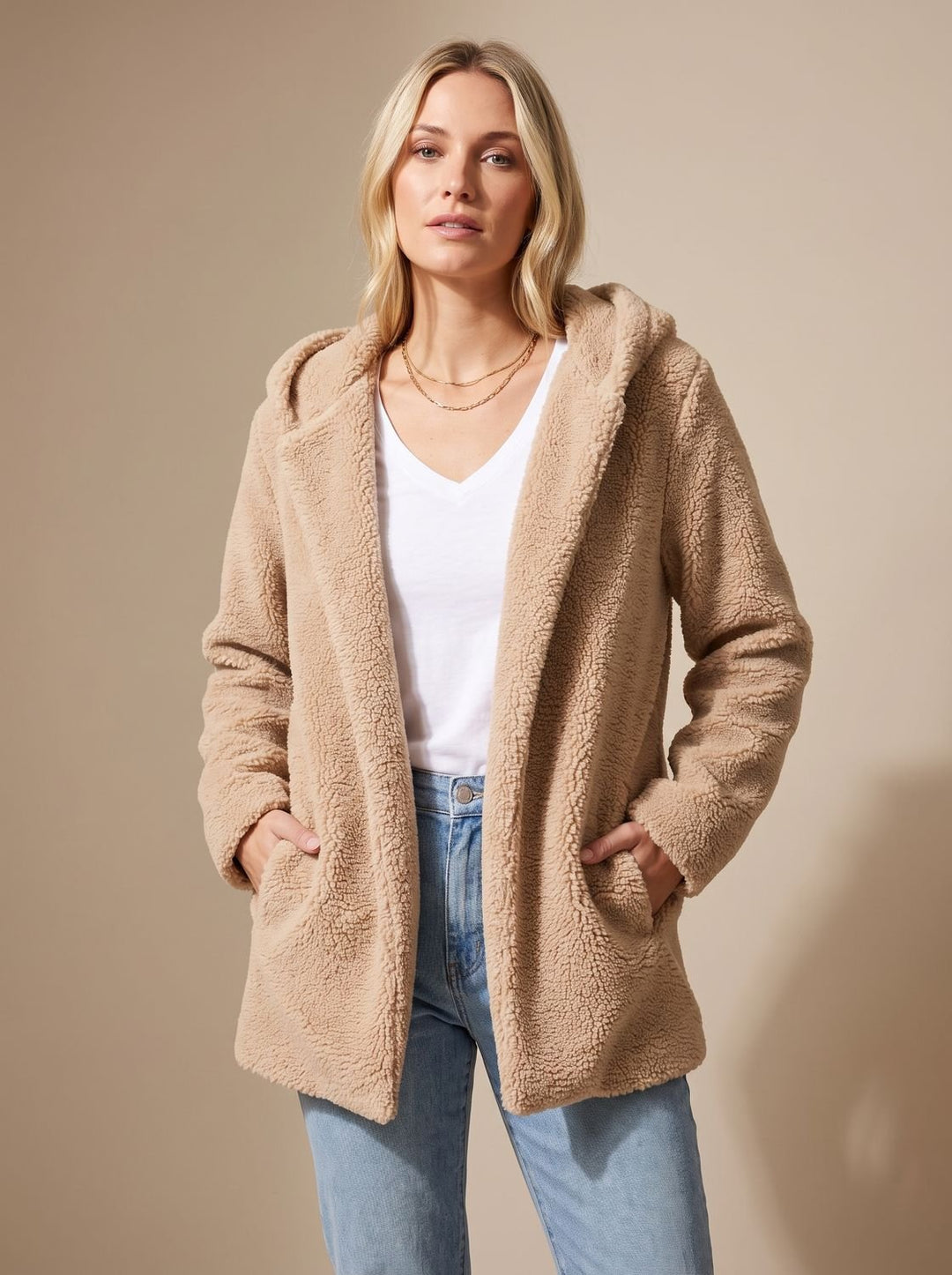 Faustina hooded teddy fleece jacket in beige, front view with hands in pockets