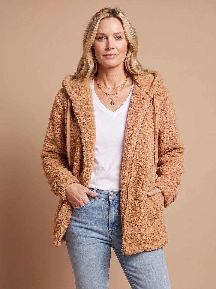 Faustina hooded teddy fleece jacket in beige, front view with hands in pockets