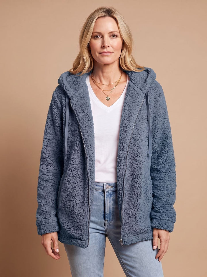 Faustina hooded teddy fleece jacket in beige, front view with hands in pockets