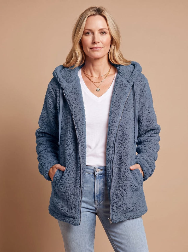 Faustina hooded teddy fleece jacket in beige, front view with hands in pockets