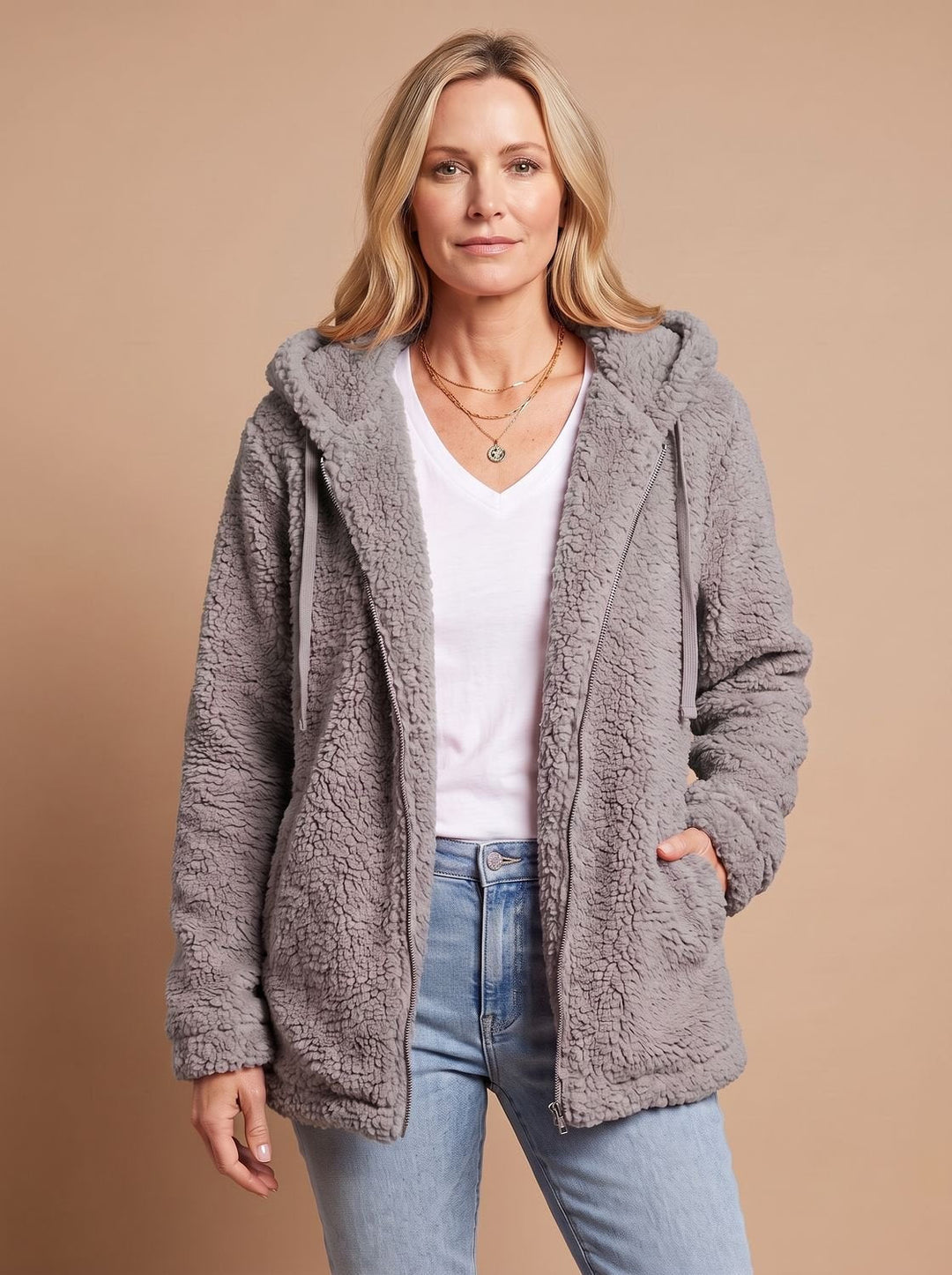 Faustina hooded teddy fleece jacket in beige, front view with hands in pockets