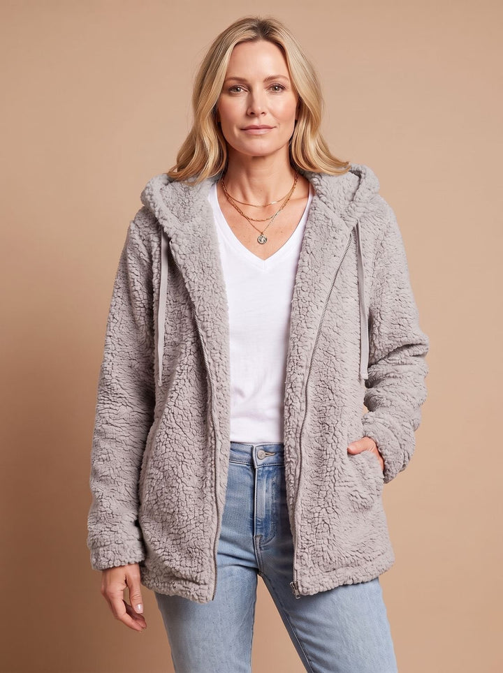 Faustina hooded teddy fleece jacket in beige, front view with hands in pockets