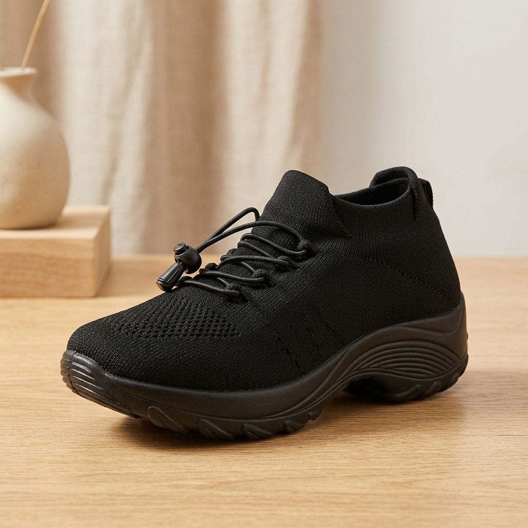 Verity all-black knit platform sneakers, side profile