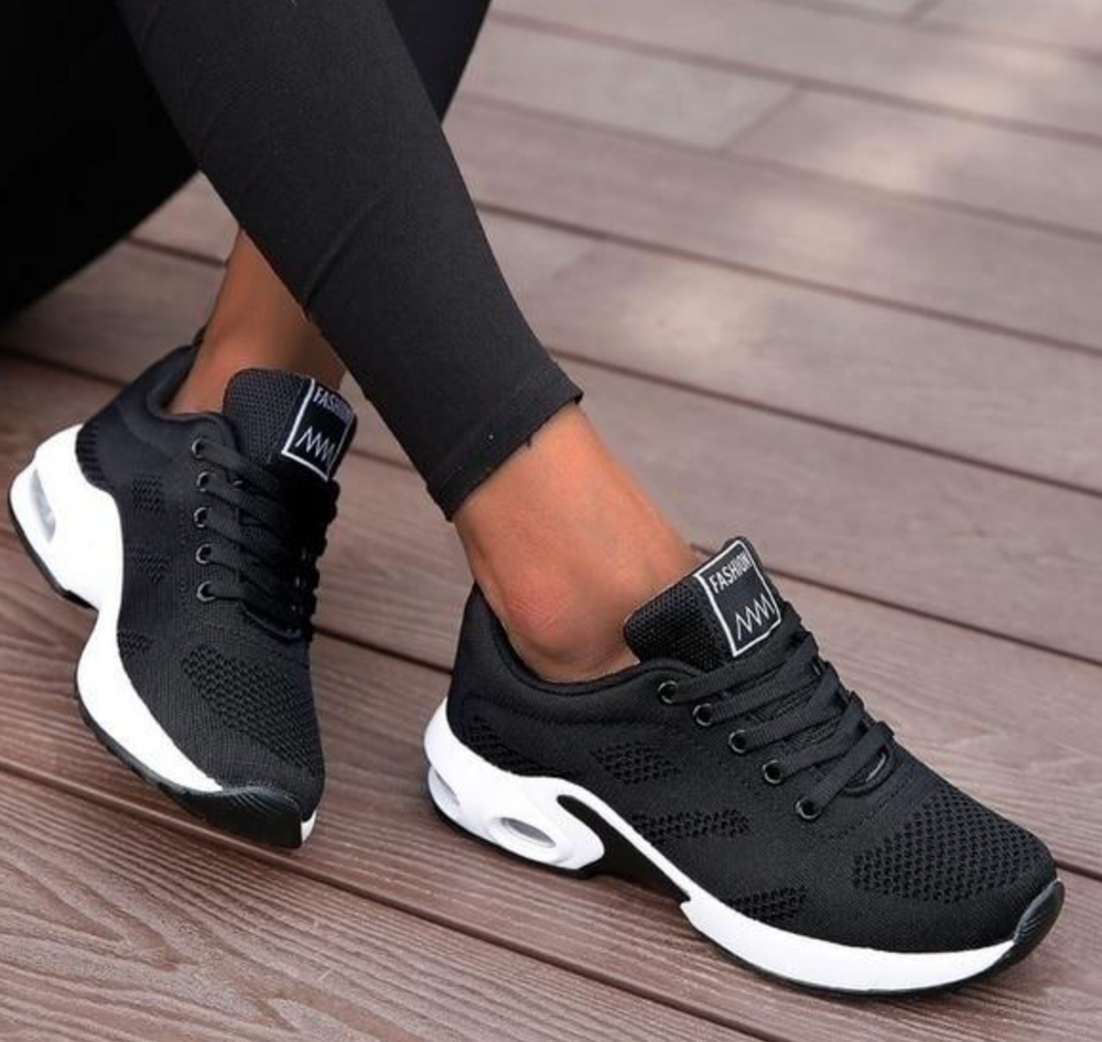Felicity black lace-up cushioned sneakers with white sole, side view