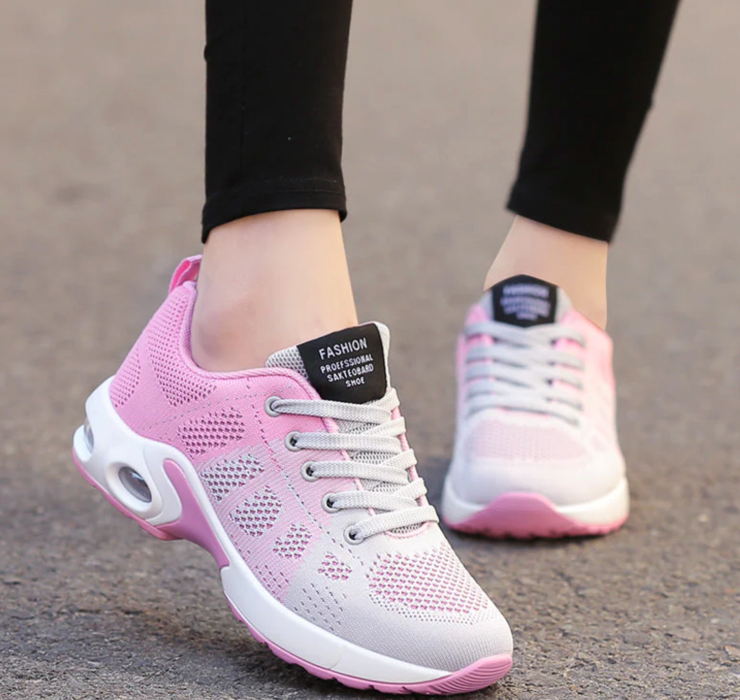 Felicity pink and grey lace-up cushioned sneakers, close-up on feet