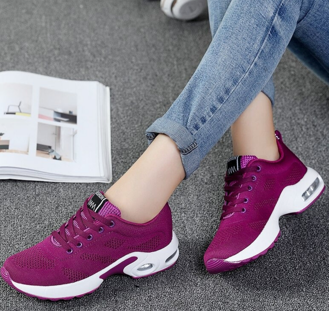 Felicity pink and grey lace-up cushioned sneakers, close-up on feet