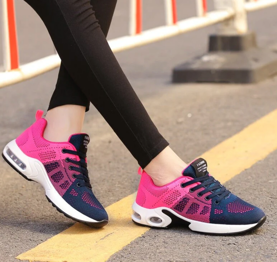 Felicity pink and grey lace-up cushioned sneakers, close-up on feet