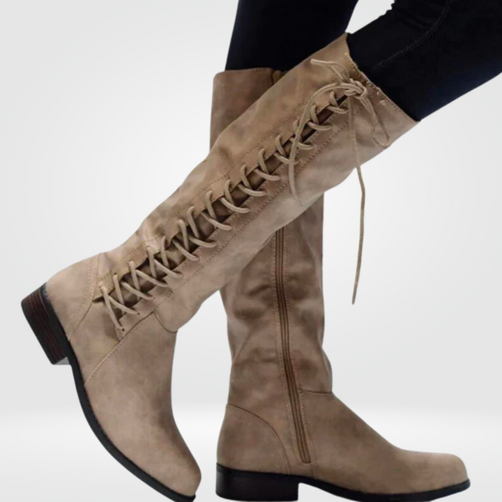 Thessaly lace-up knee-high boots in beige, side view on model