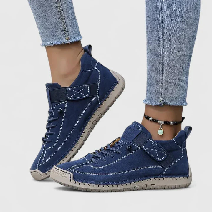 Noor dark blue lace-up sneakers on model, side view