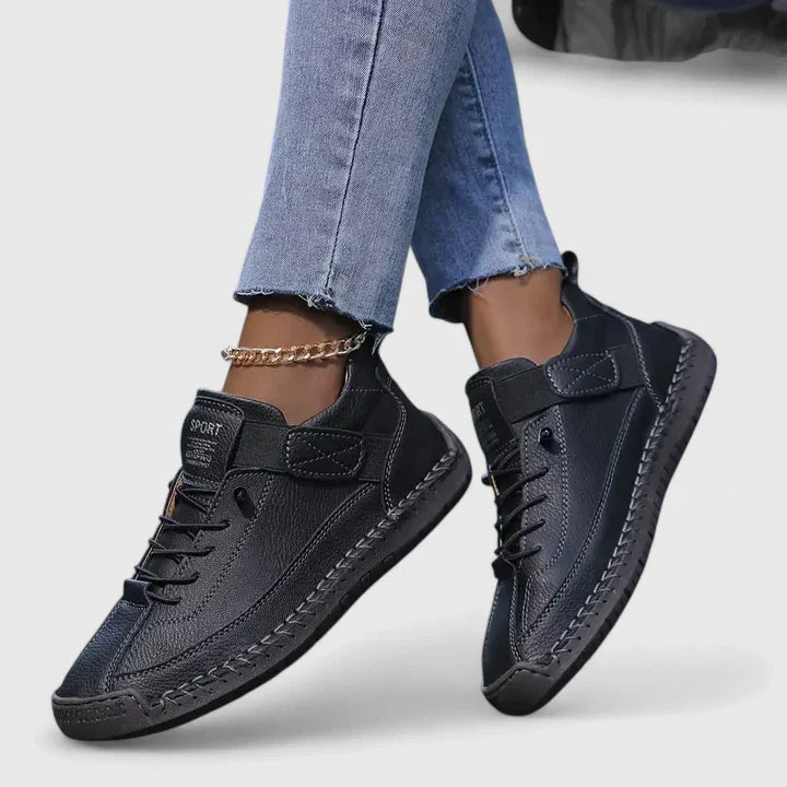 Noor dark blue lace-up sneakers on model, side view