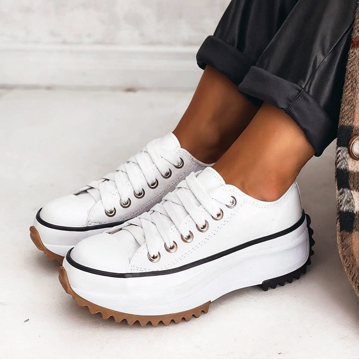 Odessa lace-up platform sneakers in white, side view on foot