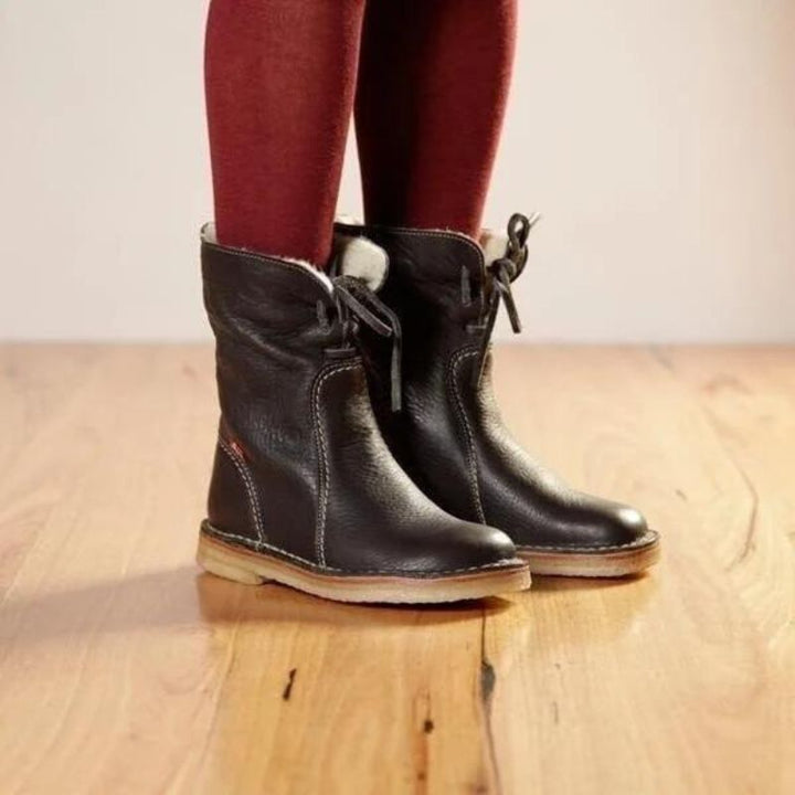 Rosemarie winter boots in dark brown, side view on model