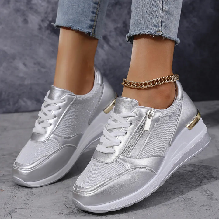 Faustine silver walking sneakers worn on feet, side view
