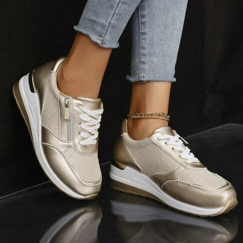 Faustine pink walking sneakers worn on feet, angled view