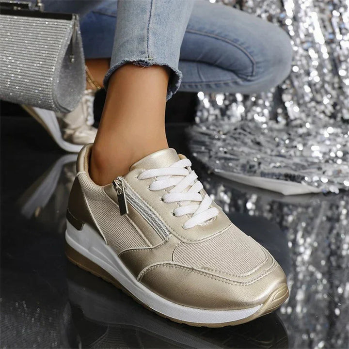 Faustine pink walking sneakers worn on feet, angled view