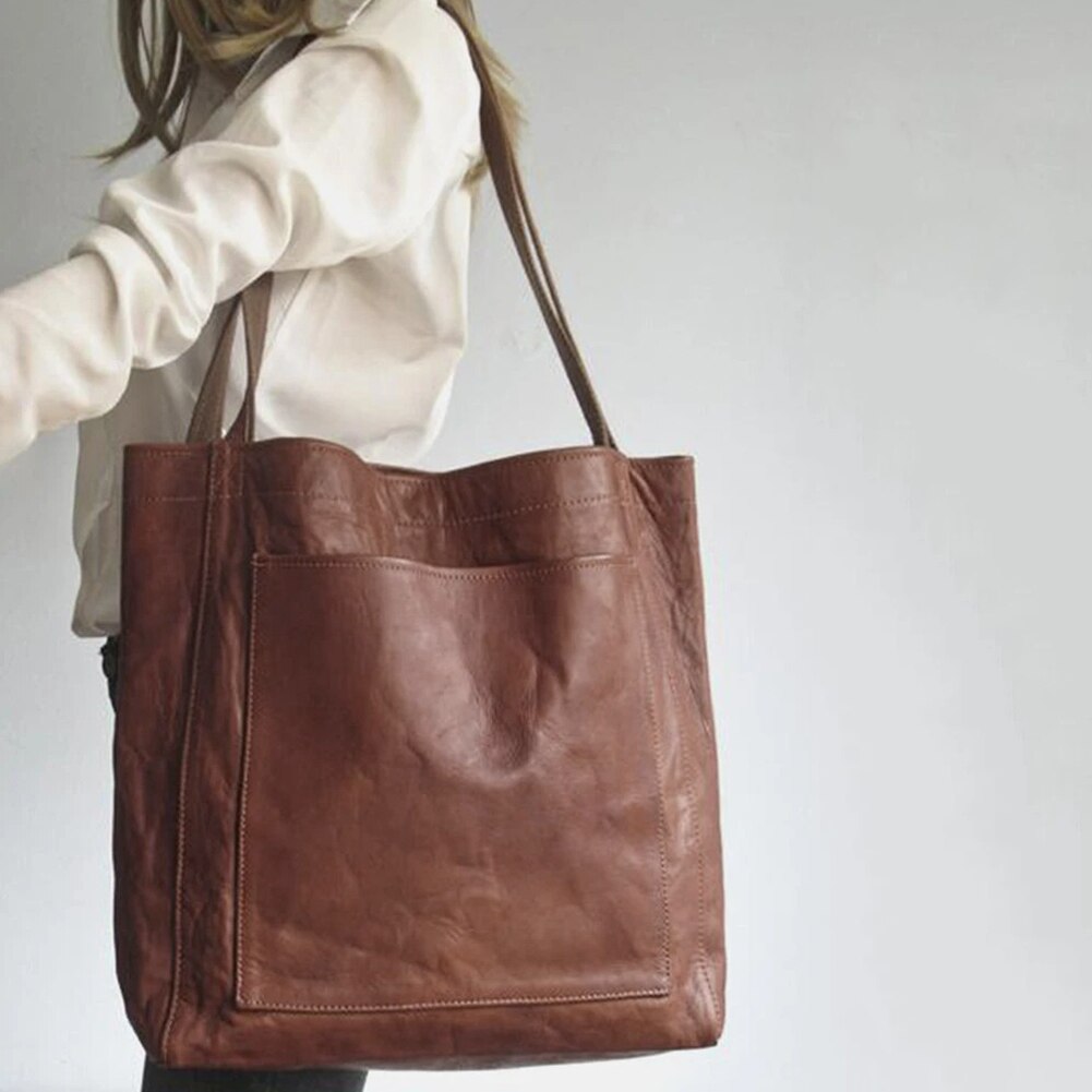 Marisabel leather tote bag worn on shoulder, side view