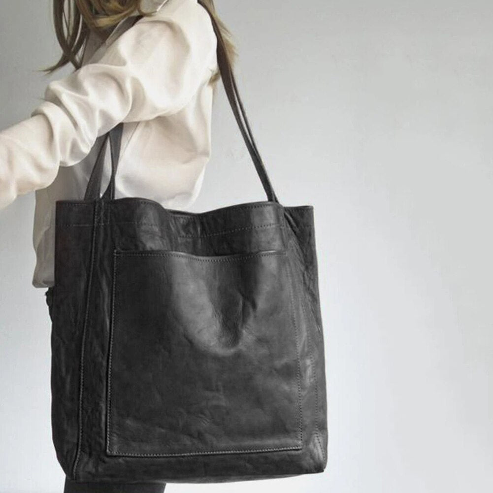 Marisabel leather tote bag worn on shoulder, side view
