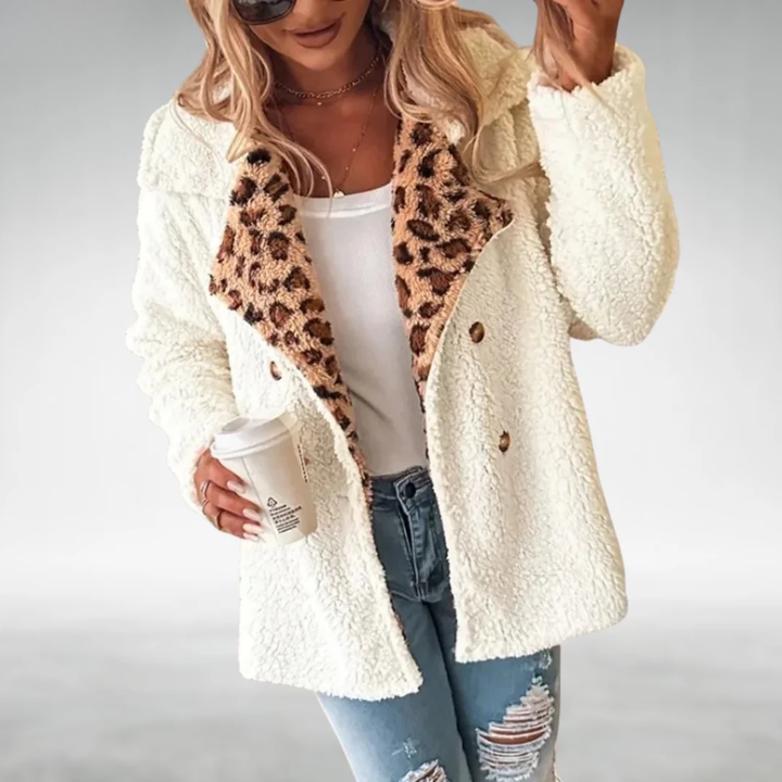 Marisela oversized teddy jacket with leopard accent, holding coffee cup