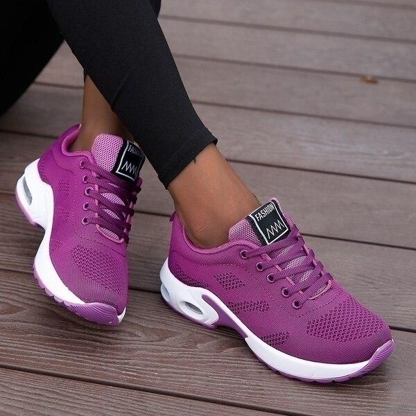 Marguerite pink and white lace-up sneakers, close-up on model
