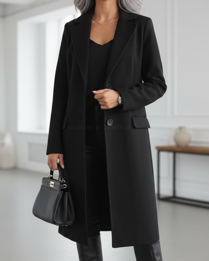 Marguerite black longline coat, front view with handbag