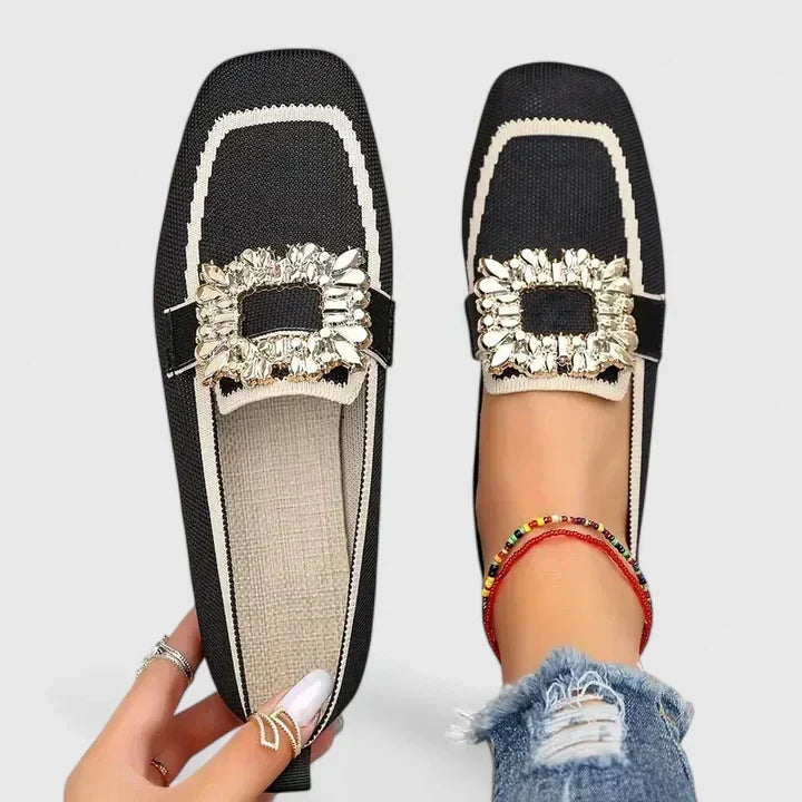 Odessa black embellished buckle loafers with contrast piping, top and side view