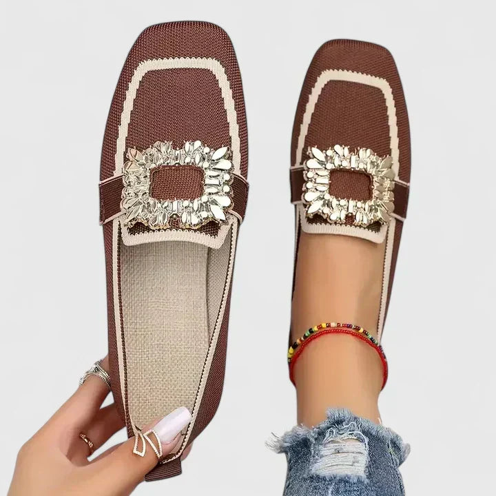 Odessa orange embellished buckle loafers, top and side view on model