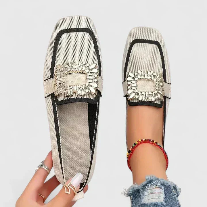 Odessa orange embellished buckle loafers, top and side view on model