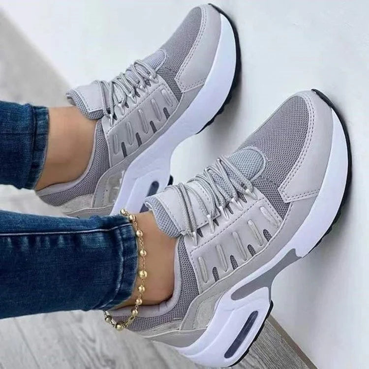 Lucinda grey lace-up platform sneakers worn on feet, front view