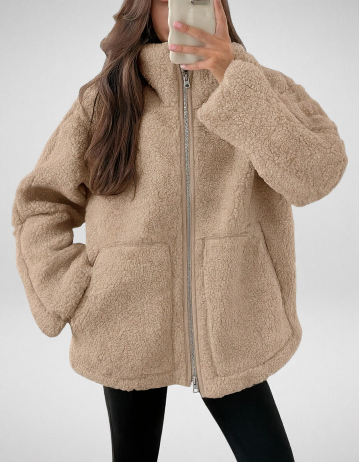Veronique oversized teddy jacket in tan, front view with hand in pocket