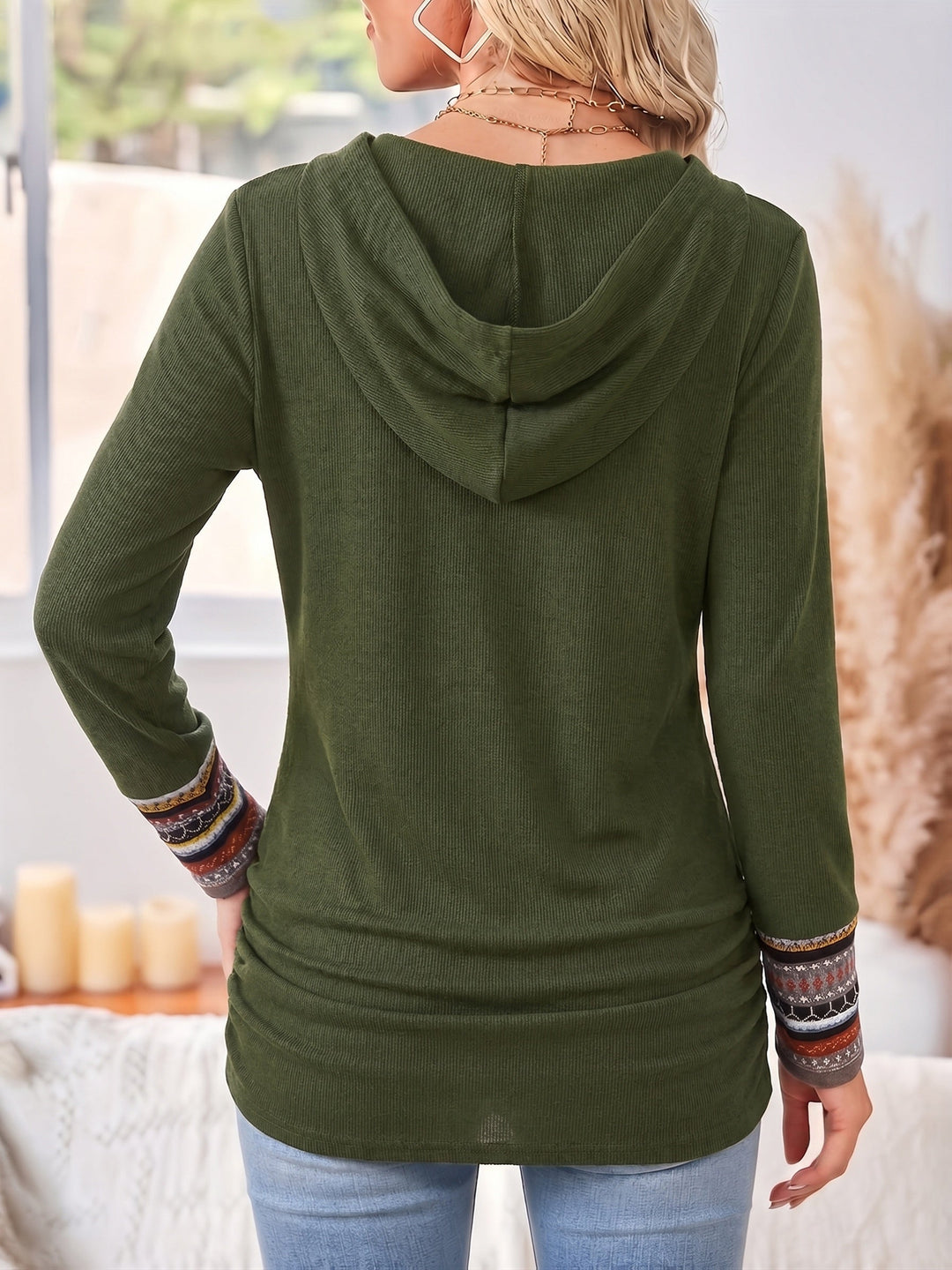 Fenwick patchwork cowl neck hoodie, side view with coffee cup