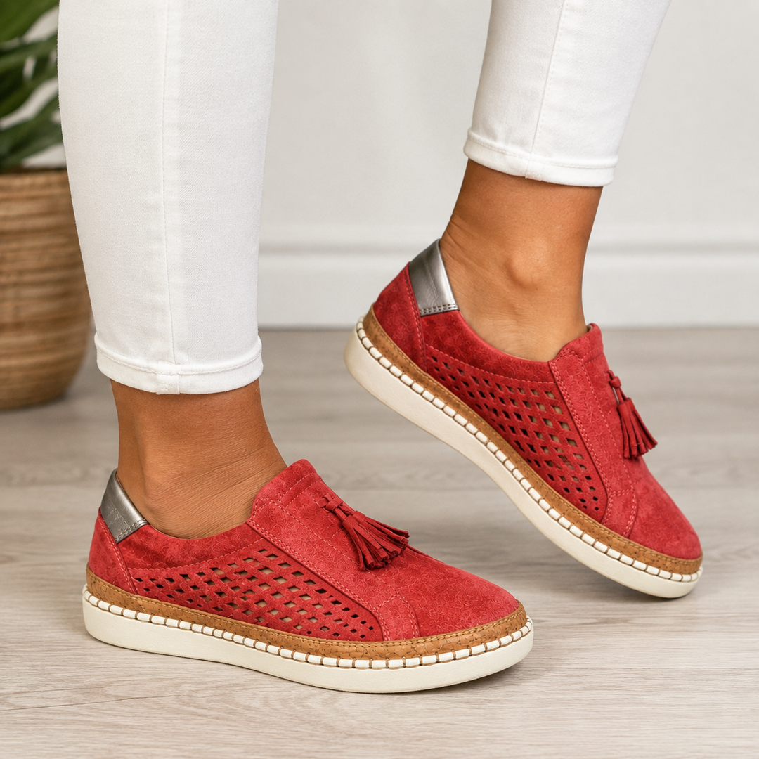Marisette red perforated slip-on loafers with tassel detail