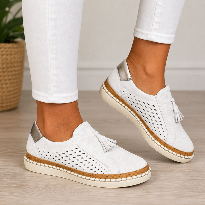 Marisette green perforated slip-on loafers with tassel detail