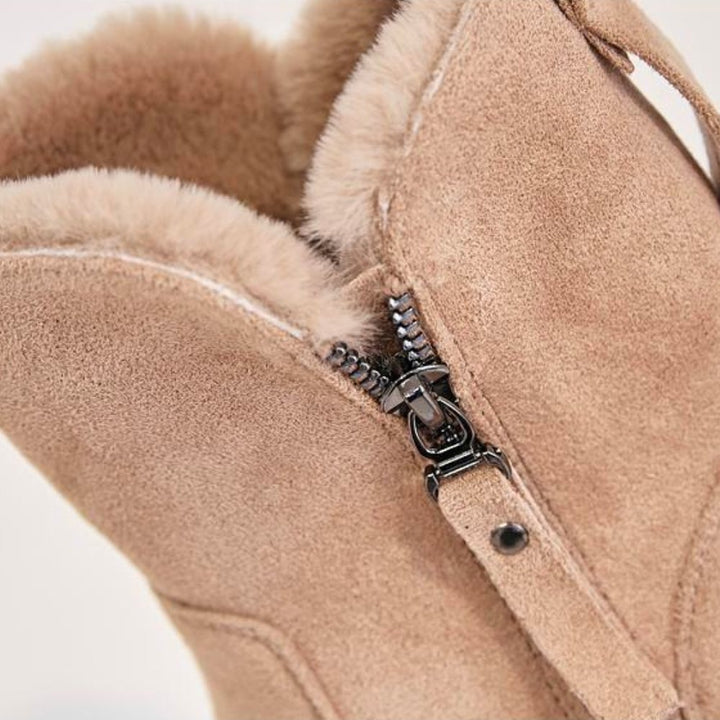 Wynne apricot winter boots, side profile held by hand