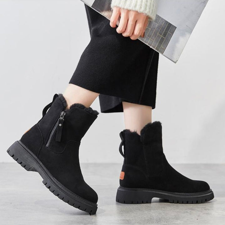 Wynne black platform winter boots with side zipper, walking shot
