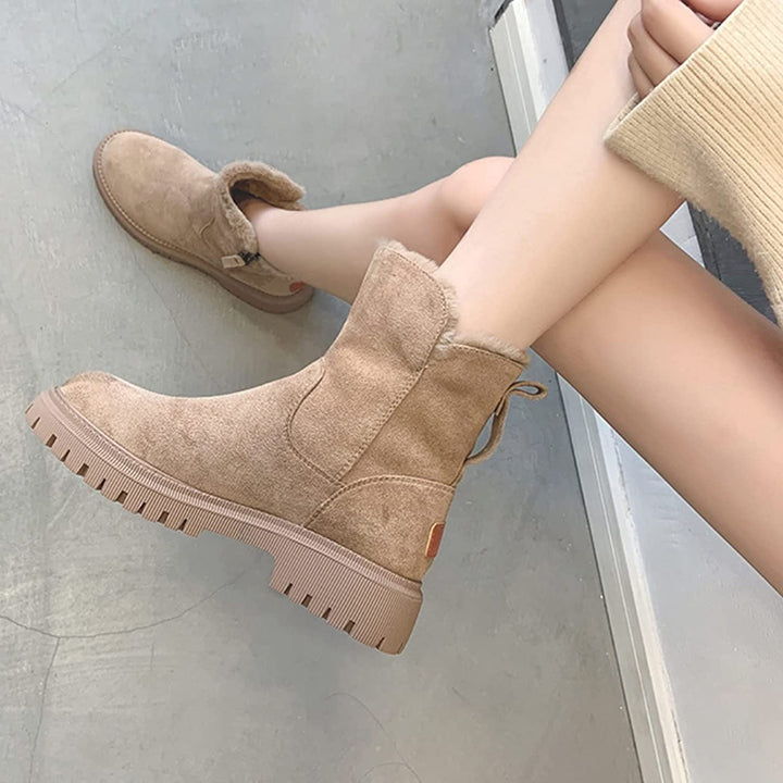 Wynne apricot winter boots, side profile held by hand