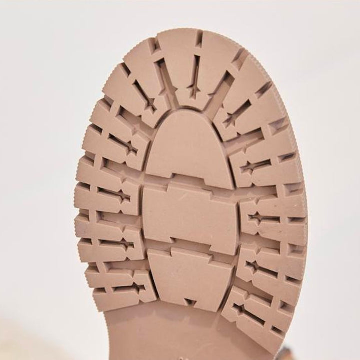 Wynne apricot winter boots, side profile held by hand