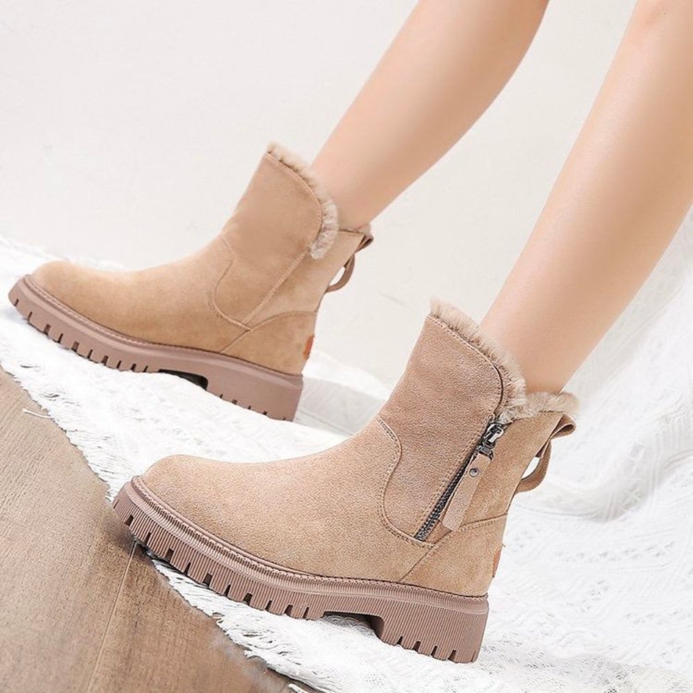 Wynne apricot winter boots, side profile held by hand