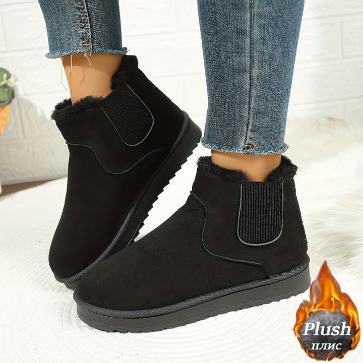 Rosemary black plush-lined ankle boots on model, side view