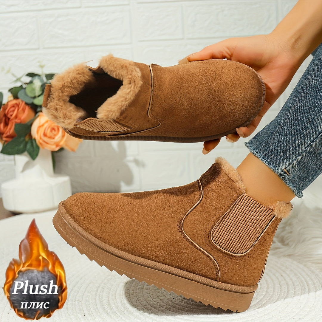 Rosemary ankle boot held by hand showing plush lining detail