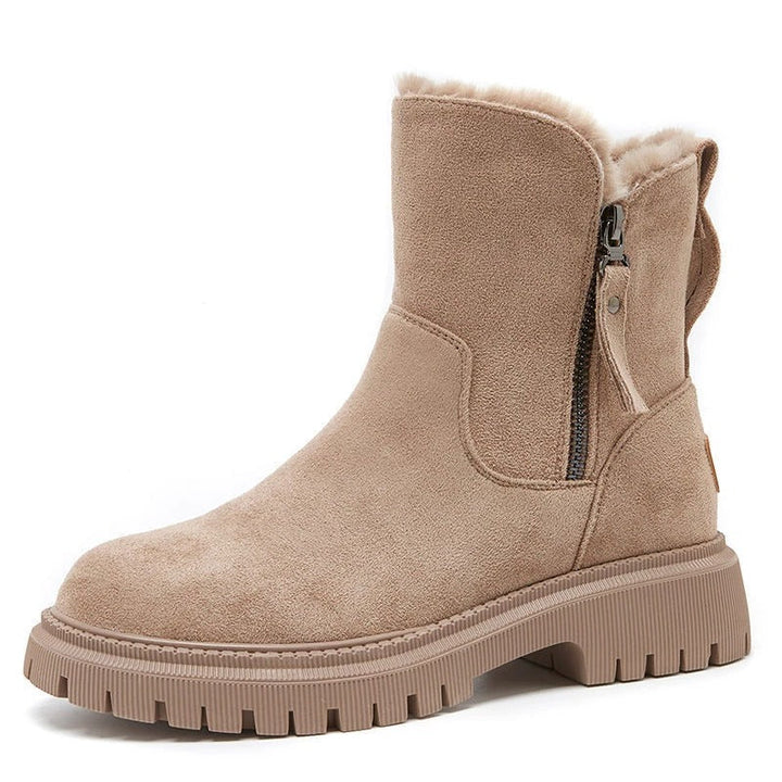 Marigold black ankle boots worn walking, side view