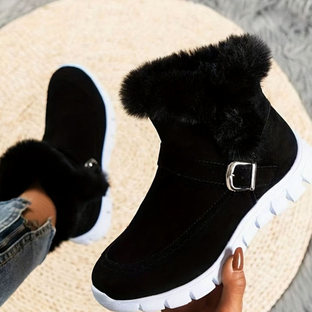 Faustine plush trim ankle snow boots in black, top view with buckle detail